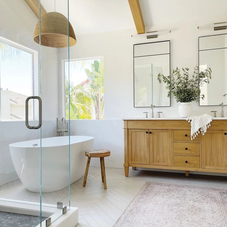 rattan pendant light, bathroom lighting ideas, natural bathroom design, organic modern interiors, coastal bathroom style, spa-inspired bathrooms, boho bathroom decor, minimalist bathroom, bathroom lighting trends, interior design tips, earthy color palettes, sustainable home decor, handmade lighting, woven lighting fixtures, modern rustic bathrooms, bathroom renovation ideas, architectural lighting, textural design elements, natural textures, warm neutral interiors, modern boho style, soft lighting ideas, relaxed luxury interiors, bathroom styling tips