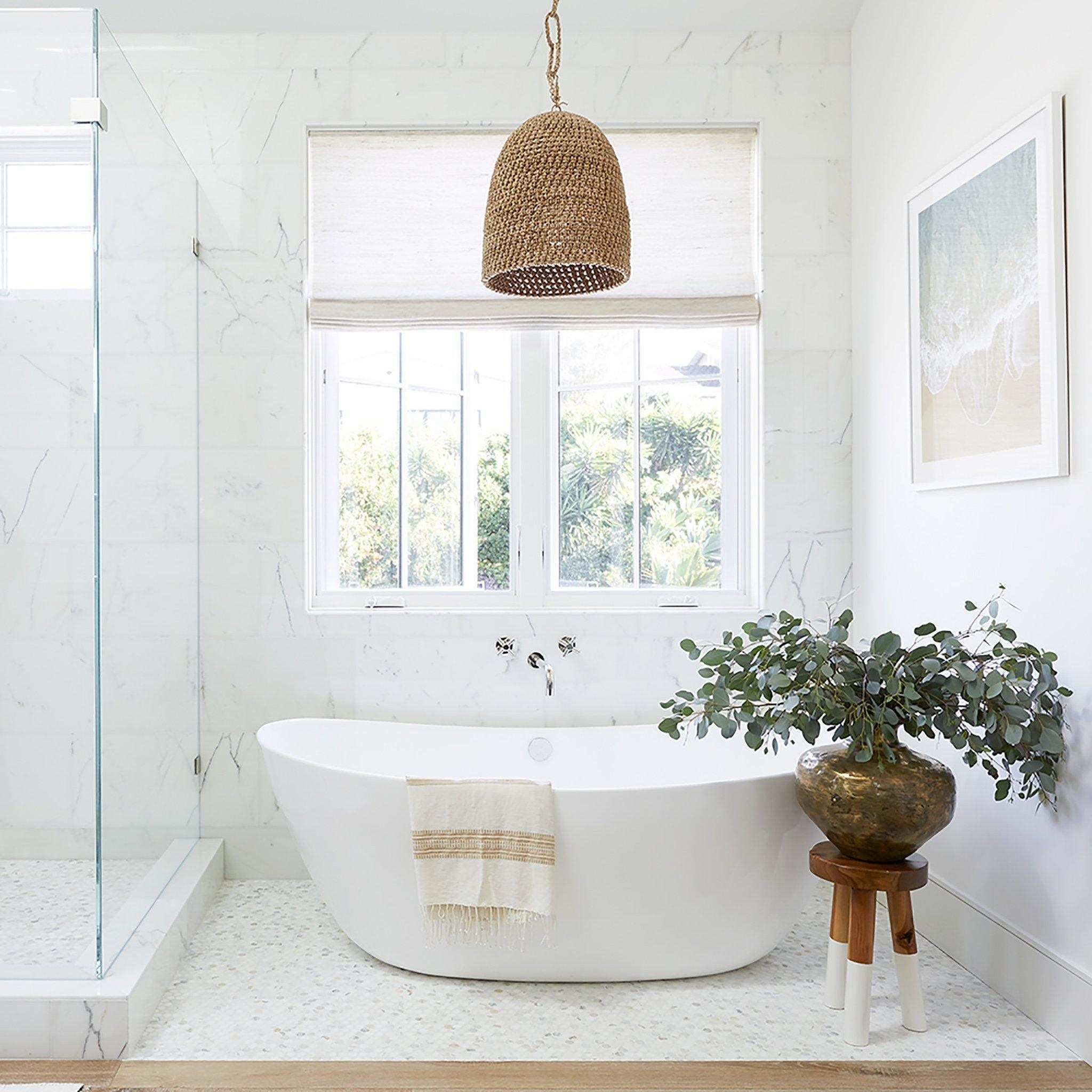 rattan pendant light, bathroom lighting ideas, natural bathroom design, organic modern interiors, coastal bathroom style, spa-inspired bathrooms, boho bathroom decor, minimalist bathroom, bathroom lighting trends, interior design tips, earthy color palettes, sustainable home decor, handmade lighting, woven lighting fixtures, modern rustic bathrooms, bathroom renovation ideas, architectural lighting, textural design elements, natural textures, warm neutral interiors, modern boho style, soft lighting ideas, relaxed luxury interiors, bathroom styling tips