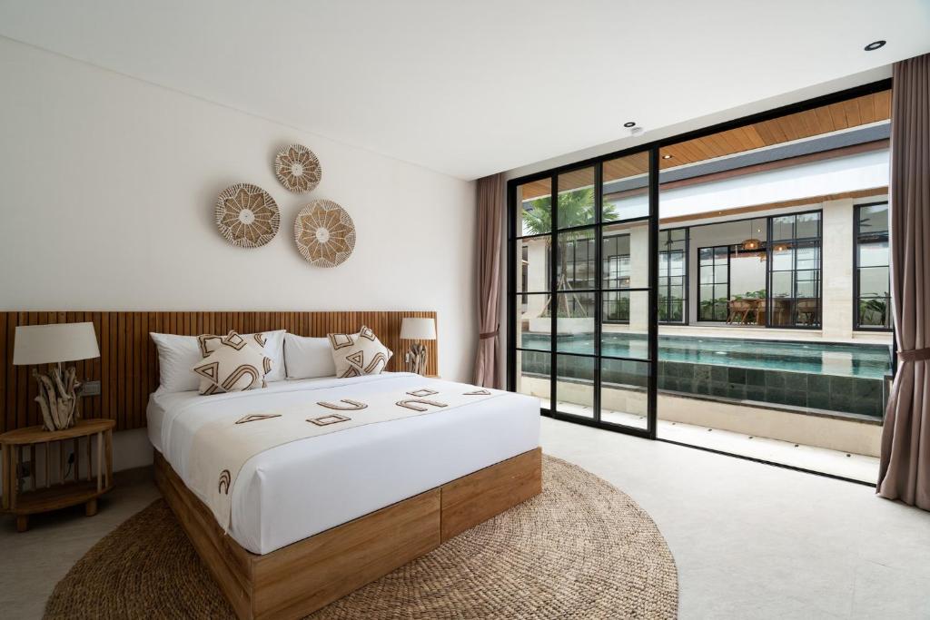 Tempat tidur dalam kamar di Asmara by BaliSuperHost