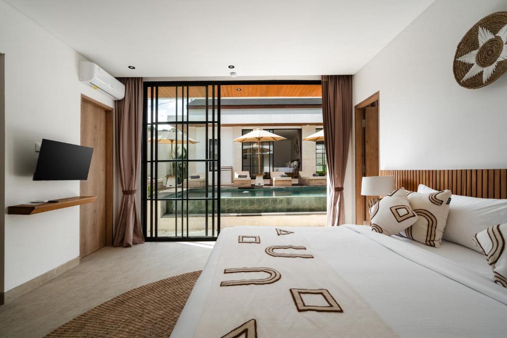 Tempat tidur dalam kamar di Asmara by BaliSuperHost