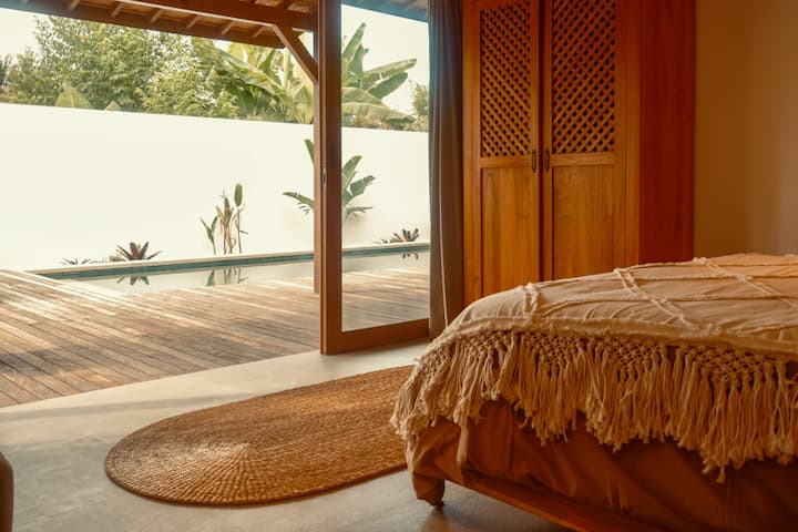 View from the first of two bedrooms onto the new deck and pool.